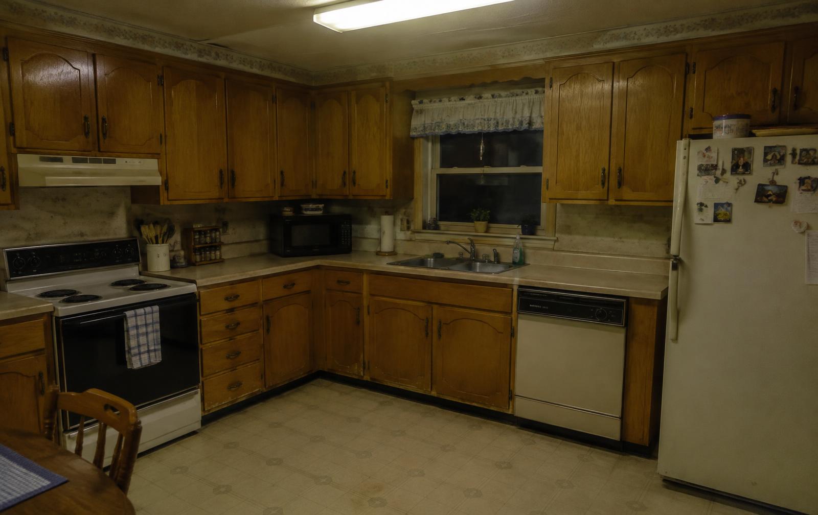 Original dated kitchen with worn oak cabinets
